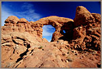 Woman stands on west side of Tunnel Arch