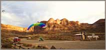 Flyer landing with mountains in the reat.