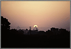 Distant Sunset behind the Pyramids.